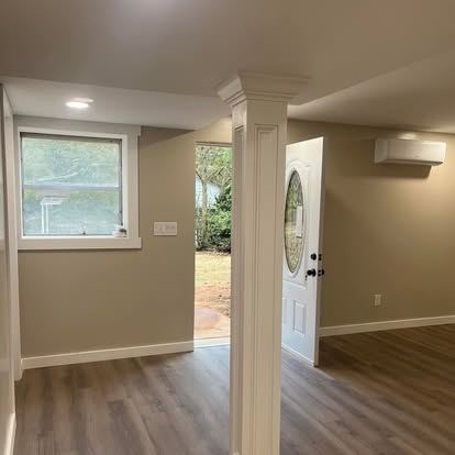 Basement entry area with column and exterior door