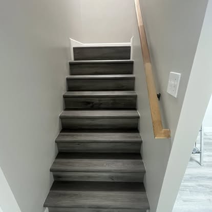 Basement staircase with dark treads