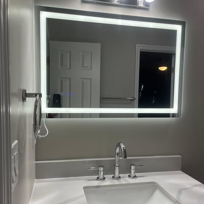 Bathroom vanity with illuminated mirror