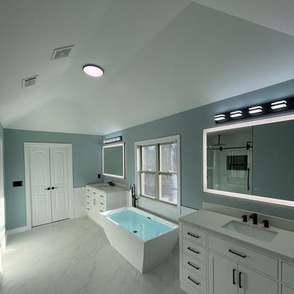 Luxury bathroom with freestanding tub and dual vanity
