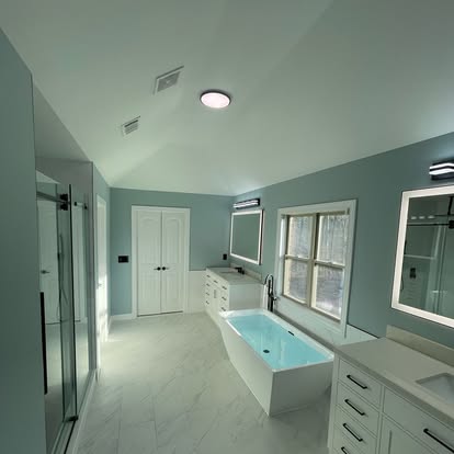 Full bathroom layout with custom lighting and fixtures