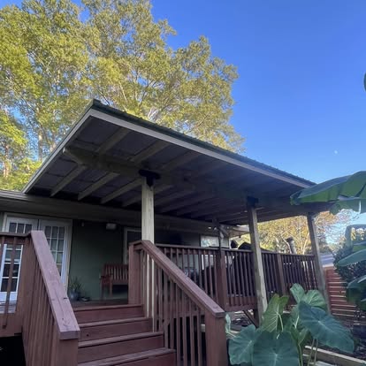 Covered deck with steps and railing