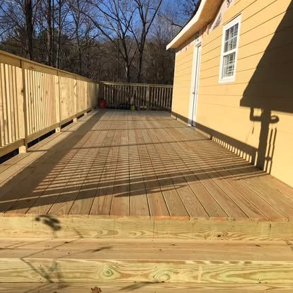 Large deck platform beside house