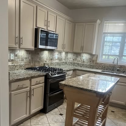 Traditional kitchen with island and granite counters