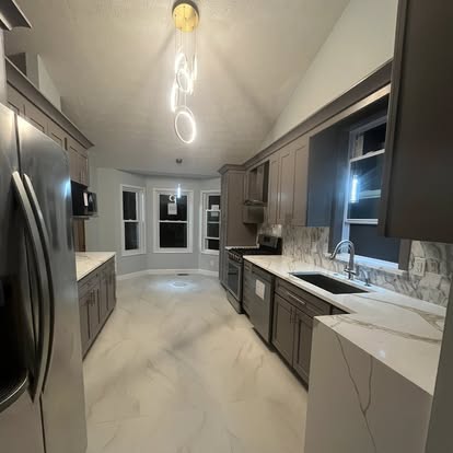 Kitchen remodel view toward back windows and sink